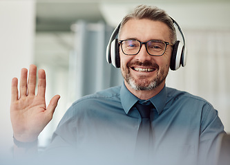 Image showing Headphones, portrait and man wave on video call for business, smile or chat at home. Happy face, hello and webinar of mature manager with glasses in virtual meeting, online conference and remote work