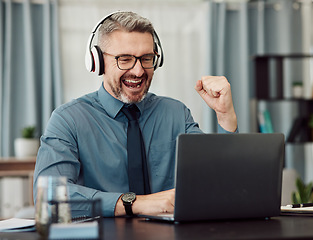 Image showing Celebrate, headphones and businessman working on a laptop with good news or achievement. Happy, excited and mature professional male designer in celebration for job promotion or success in workplace.