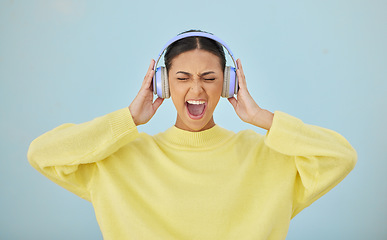 Image showing Music, shouting and headphones with a woman in studio on a gray background while streaming audio. Radio, screaming or expression and a young person listening to sound or noise with her eyes closed