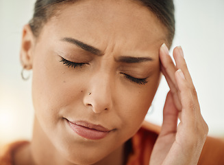 Image showing Face, woman and pain of headache from stress, mental health and sick of fatigue. Closeup of sad female person with depression, anxiety or frustrated with brain fog, debt and crisis of burnout