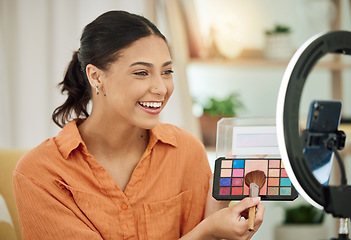 Image showing Happy woman, makeup influencer and live streaming with phone, social media and beauty vlog at home. Gen z content creator with cosmetics palette for online broadcast, mobile podcast or digital review