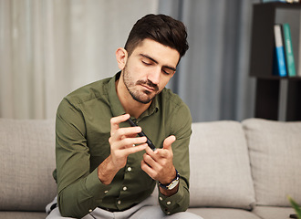 Image showing Man, diabetes and blood sugar check with pen for healthcare and insulin monitor at home. Male person, medical test and glucose analysis in a living room with medicine, care and clinic tool in a house