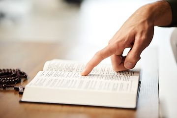 Image showing Hands, christian and bible book with rosary for praying, spiritual faith and holy worship of God in heaven. Closeup of person studying religion, learning prayer and scripture story of Jesus Christ