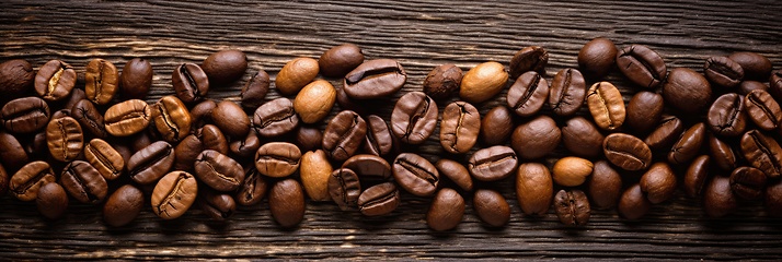 Image showing Coffee beans on wooden background