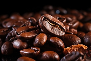 Image showing Coffee beans heap on black