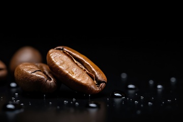 Image showing Coffee beans heap on black