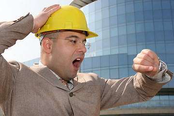 Image showing businessman looking at his watch