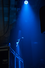 Image showing microphone in concert hall with blue lights