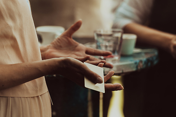 Image showing Close-up photo of female hand gesturing while talking to business partner