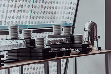 Image showing A table in a modern hotel with dishes ready to serve guests