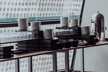 Image showing A table in a modern hotel with dishes ready to serve guests