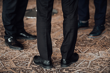 Image showing Close up photo of male businessmen in suits talking