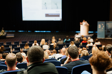 Image showing Speaker giving a talk on scientific conference. Audience at the conference hall. Business and Entrepreneurship concept.