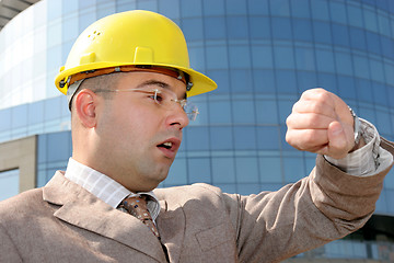 Image showing businessman looking at his watch