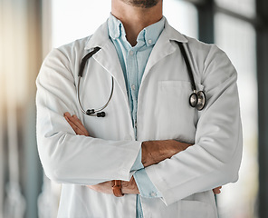 Image showing Healthcare, trust and a doctor arms crossed in the hospital for a wellness appointment of checkup. Medical, confidence and a medicine professional in a clinic for health, consulting or cardiology