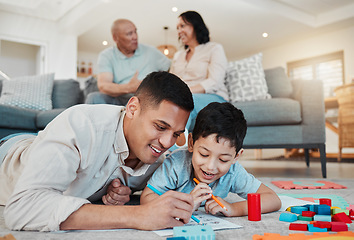 Image showing Dad, child and drawing, playing on floor of living room and bonding with quality time together in family home. Learning, fun and happy father with son, building block games and smile with education.