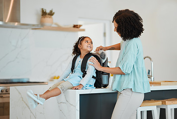 Image showing Mother, girl and packing bag for lunch, food and nutrition, wellness and development for morning school. African mom, lunchbox and backpack of child for healthy diet, care and happy in home kitchen