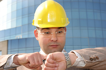 Image showing businessman looking at his watch