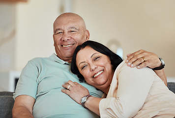 Image showing Portrait, smile and senior couple in home living room, bonding and relax together. Face, happy and elderly man and woman hug on sofa in lounge, enjoying quality time in house with love and retirement