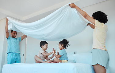 Image showing Children, play and family with blanket in bedroom, bonding and smile together. Interracial, kids game and father and mother at bed with sheet for patty cake, happy and enjoying quality time in house