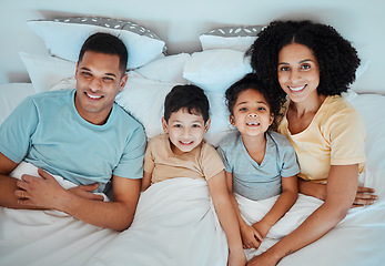 Image showing Top view, bed and portrait of parents with children for bonding, quality time and affection in morning. Happy, family and above of mother, father and kids in bedroom for fun, sleeping and relaxing