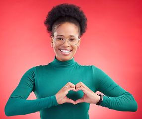 Image showing Happy woman, portrait and heart hands for love, care or romance against a red studio background. Female person smile with emoji, symbol or shape for romantic gesture, health support or like on mockup