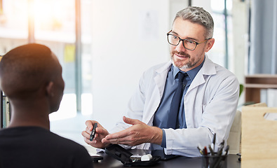 Image showing Consulting, doctor and diabetes with man and patient in hospital for advice, glucose exam and blood test. Healthcare, medicine and feedback with people in clinic for discussion, results and wellness