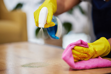 Image showing Spray, hands and person cleaning table, furniture and housekeeping services at home. Closeup of cleaner wipe surface with cloth, bottle of chemical product and disinfection of dust, bacteria and dirt