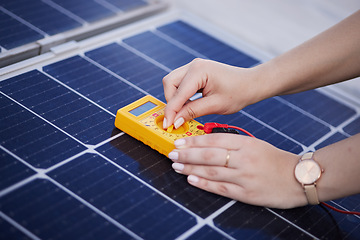 Image showing Solar panels, voltage meter and hands for renewable energy, electricity or innovation. Closeup, charge and a person with gear for sustainable lighting, grid or photovoltaic tools for a home generator