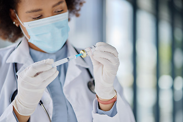 Image showing Healthcare, woman or a doctor with a vaccine for a virus or health medicine in a hospital. Face mask, safety and an African nurse or surgeon with a drug vial and syringe for nursing at a clinic