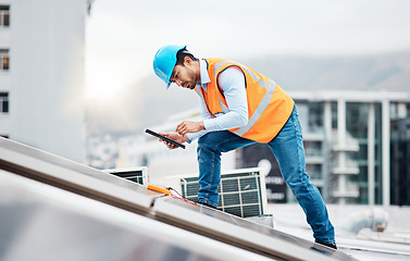 Image showing Solar panel, tablet and engineering with man on roof top for renewable energy, project and power. Construction, electricity and sustainability with contractor in city with tools and photovoltaic grid