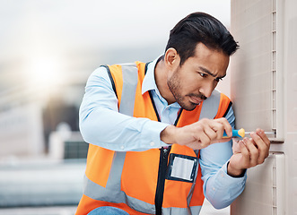 Image showing Tools, engineering and man with air conditioner panel for repair, maintenance and inspection on roof. Heating, technician and male worker with equipment for service, installation or electricity check