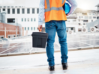 Image showing Tool box, construction worker and back with solar panel maintenance and labor outdoor. Roof, eco engineer and green energy project with builder and sustainability contractor with building project