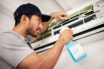 Image showing Air conditioner, cleaning and man with electrical machine check in a home with ac repair. Maintenance, spray and system wash for installation, inspection of aircon fix in a house with contractor