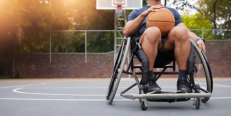 Image showing Wheelchair, basketball and man with sports ball at outdoor court for fitness, training and cardio. Exercise, hobby and male with disability at a park for game, workout and weekend fun or active match