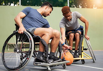 Image showing Sports, basketball and men in wheelchair playing for training, exercise and workout on outdoor court. Fitness, team and male people with disability tackle for ball for competition, practice and games