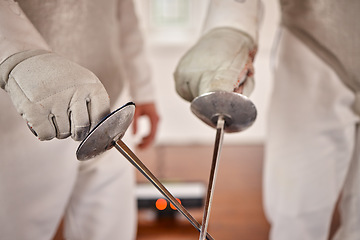 Image showing Fencing, hands or fight with a sword in training, exercise or fighting workout with a weapon in sports. Martial arts, closeup or combat fighters in competition with blade for fitness or coaching