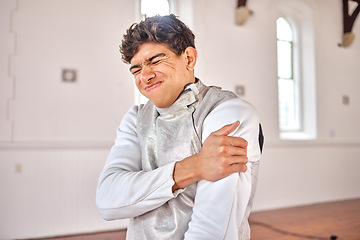 Image showing Fencing, man and shoulder pain, injury or accident after training, exercise or workout in club. Fencer, body problem and athlete with arthritis, fibromyalgia or osteoporosis, wound and emergency