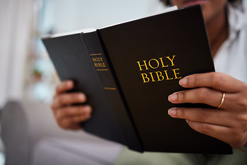 Image showing Hands, bible and woman reading in home, lounge and book of prayer, religion and worship faith in study of mindfulness. Person, praying and studying holy books for peace, praise and meditation