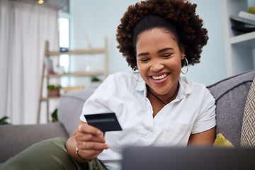 Image showing Happy black woman, laptop and credit card for ecommerce, payment or banking on sofa at home. African female person or shopper smile with debit on computer app for online shopping, purchase or buying