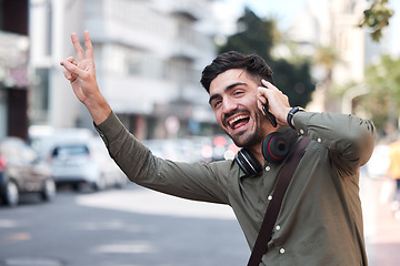 Image showing Man, phone call and wave for taxi, city and smile for peace sign language, emoji or funny face on sidewalk. Young entrepreneur, smartphone and street to stop bus, transportation and driver for travel