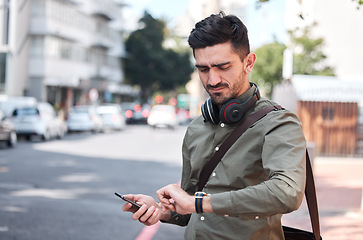 Image showing Business man, check watch and street with thinking, travel and waiting for transportation in metro cbd. Young entrepreneur, clock and schedule on sidewalk for taxi, bus or chauffeur for drive to work