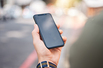 Image showing Phone, mockup and hands of man in a city with connection, contact and app for a location. Cellphone, screen and male online for directions, search internet and guide with network, street and travel