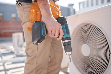 Image showing Hands, man and outdoor for air conditioner maintenance, roof and building in city, drill or construction. AC repair, hvac system and tools for engineer, technician or expert in ventilation on rooftop