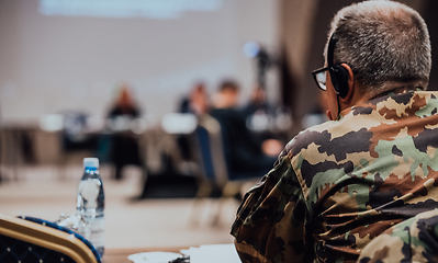 Image showing Photo of a soldier leading a seminar for professional training of military personnel