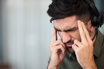 Image showing Telemarketing, call center and man with a headache, burnout and tech support with stress, pain and overtime. Male person, employee or consultant with a migraine, health fatigue and agent with tension