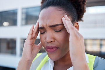 Image showing Face, sad and woman in construction with headache at renovation site, civil engineering mistake and stress. Confused, tired and frustrated african contractor with burnout, crisis and problem in city