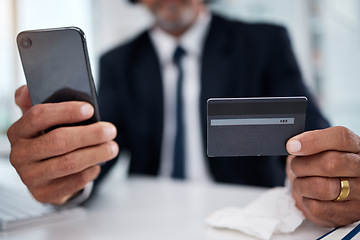 Image showing Man, hands and credit card with phone in office for ecommerce, accounting budget or banking investment. Closeup, worker and mobile for online shopping, fintech and trading money in financial economy