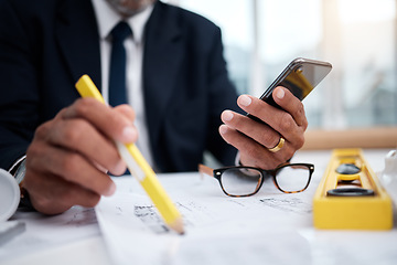 Image showing Phone, hands and pencil of architect man in an office with a blueprint, drawing or floor plan project. Closeup of male engineer with building design, internet connection and sketch for construction