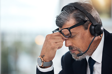 Image showing Stress, sales and man in a call center with a headache from telemarketing or technical support. Sad, fail or a mature customer service employee or boss with a mistake or problem with communication